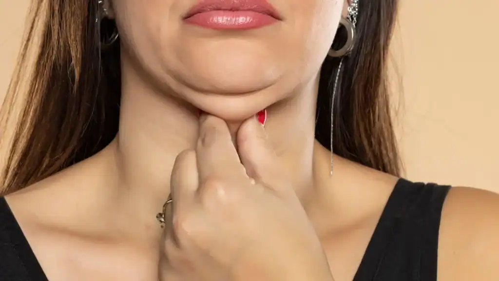 An image of a woman with double chin, sad, worried : Non Surgical Double Chin Removal Treatment in Bushey, UK
